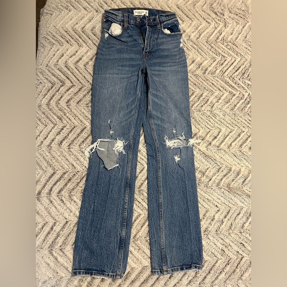 Distressed blue jeans